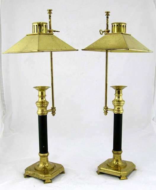 Pair of Brass Plated Candlestick Lamps, 20th c., wi: Pair of Brass Plated Candlestick Lamps, 20th c., with adjustable shades, retailed by Nieman Marcus, not electrified, H.- 23 3/4 in., W.- 7 1/4 in., D.- 7 1/4 in.