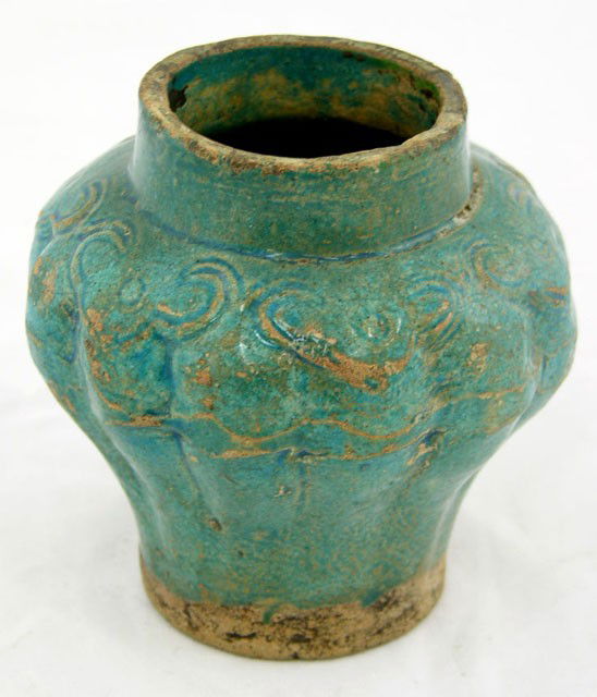 Glazed Arabic Vase, in the 16th c. style, pre 1899: Glazed Arabic Vase, in the 16th c. style, pre 1899, of bulbous form with relief decoration, in a deep blue glaze, H.- 4 3/4 in., Dia.- 4 1/2 in.