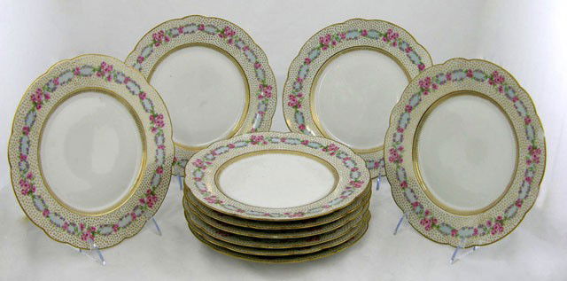 Set of Ten Limoges Dinner Plates, c. 1900, by De: Set of Ten Limoges Dinner Plates, c. 1900, by De Linieres & Co., retailed by D. B. Bedell, N. Y., also marked L. Bernardaud & Co., with gilt edge tracery, the border with hand painted roses and garlan