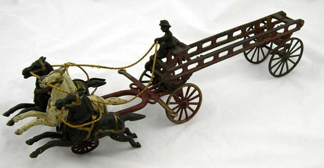 Cast Iron Toy Horse Drawn Hook and Ladder Truck, e: Cast Iron Toy Horse Drawn Hook and Ladder Truck, early 20th c., with three horses and a driver, lacking the ladders and rear driver, H.- 5 3/4 in., W.- 19 1/2 in., D.- 5 in.