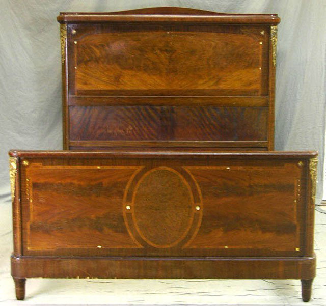 Carved and Inlaid Mahogany Brass Ormolu Mounted Do: Carved and Inlaid Mahogany Brass Ormolu Mounted Double Bed, c. 1900, with and arched crest, inlaid with burled walnut and mother-of-pearl, with replaced extra length rails, H.- 55 1/2 in., Int. W.- 56