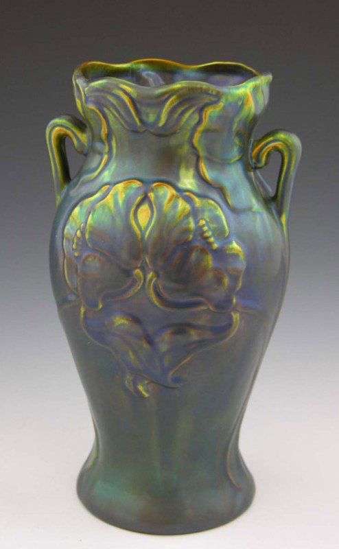 Iridescent Glaze Zsolnay Baluster Handled Vase, 20t: Iridescent Glaze Zsolnay Baluster Handled Vase, 20th c., Hungary, with relief floral decoration, H.- 9 1/2 in., W.- 4 3/4 in., D.- 4 1/4 in.