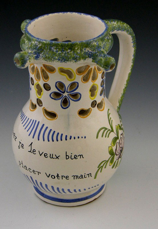 Faience Pottery Baluster Handled Vase, late 19th c.: Faience Pottery Baluster Handled Vase, late 19th c., with pierced and polychromed floral decoration, and a poem on the side, H.- 8 in., W.- 7 in., D.- 5 in.