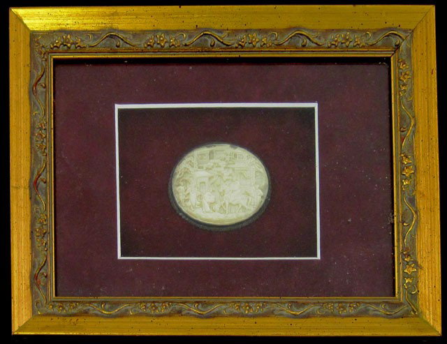 Chinese Relief Carved Oval Mother-of-Pearl Medalli: Chinese Relief Carved Oval Mother-of-Pearl Medallion, 19th c., depicting a village scene, now mounted in a shadow box frame, H.- 1 5/8 in., W.- 2 in.