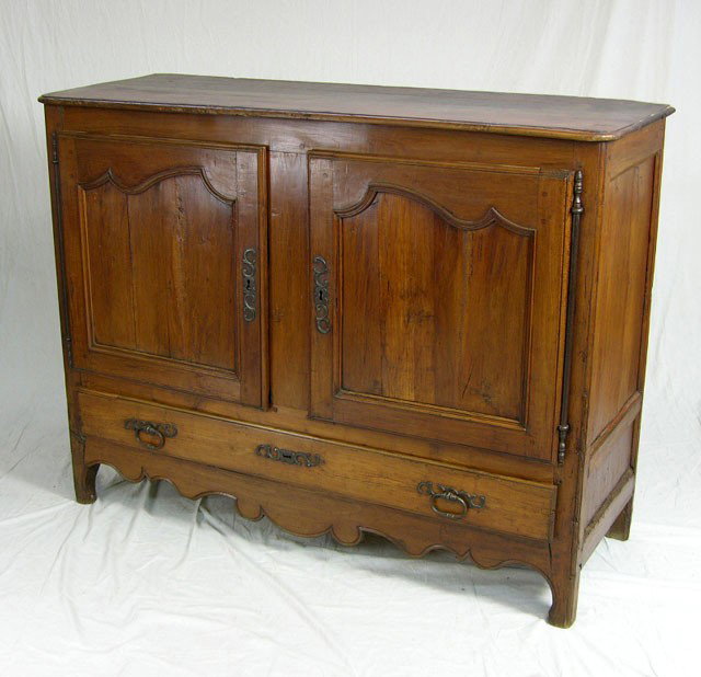 French Provincial Carved Cherry Sideboard, c. 1800: French Provincial Carved Cherry Sideboard, c. 1800, the rounded corner top over double shaped panel doors with steel escutcheons and fiche hinges, over a long lower drawer, the whole on cabriole legs,