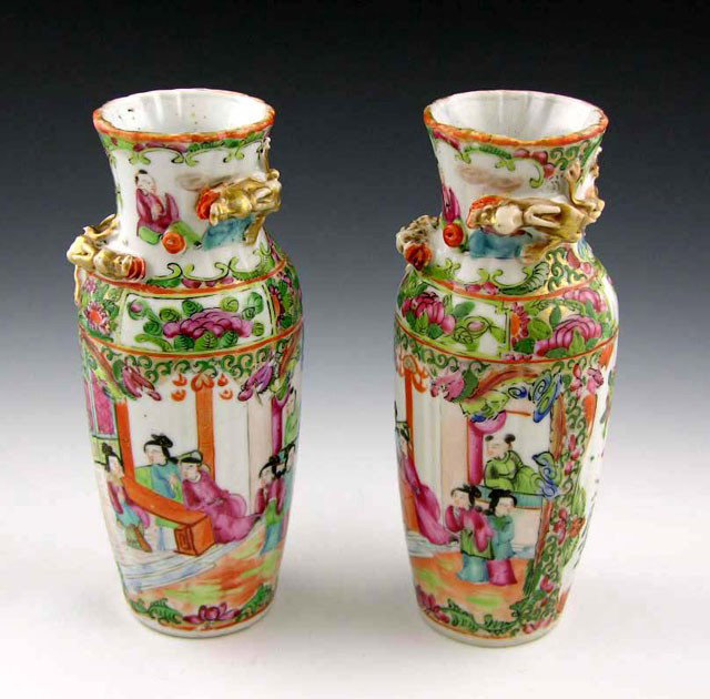 Pair of Famille Rose Baluster Vases, c. 1900, with: Pair of Famille Rose Baluster Vases, c. 1900, with applied dragons to the neck and shoulders, the sides with panel decoration of birds, bats, flowers, and interior scenes, H.- 8 1/8 in., Dia.- 3 3/8 i