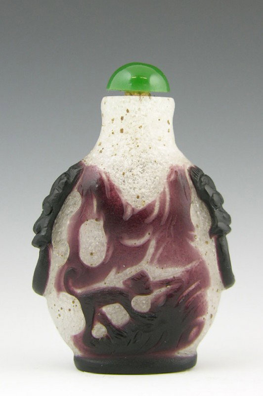 Snowflake Glass Snuff Bottle, early 20th c., with : Snowflake Glass Snuff Bottle, early 20th c., with brown overlay decoration of birds and a monkey, with integral foo lion ring handles, with a green hard stone stopper, H.- 2 5/8 in., W.- 1 3/4 in., D.