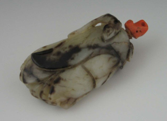 Carved Brown and White Leaf Form Snuff Bottle, 19t: Carved Brown and White Leaf Form Snuff Bottle, 19th c., with a coral stopper, H.- 2 5/8 in., W.- 1 1/2 in., D.- 1 1/4 in. Provenance: Virginia A. Rice, New Orleans Louisiana; member of the Internation