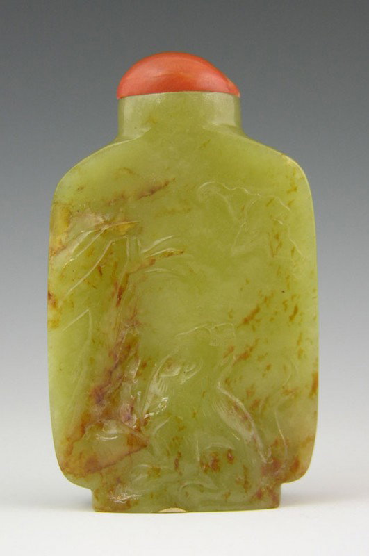 Carved Jade Natural Form Snuff Bottle, early 20th : Carved Jade Natural Form Snuff Bottle, early 20th c., the sides Carved with relief bats and a dog, H.- 2 1/2 in., W.- 1 1/2 in., D.- 3/4 in. Provenance: Collection of Virginia A. Rice, New Orleans Lou