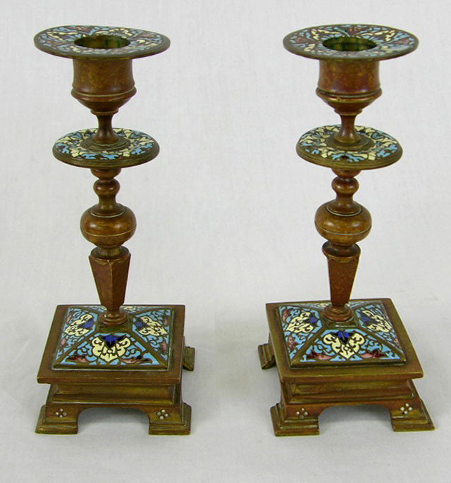 Pair of Bronze Champleve Candlesticks, 19th c., o: Pair of Bronze Champleve Candlesticks, 19th c., on turned shaped supports, to sloping bases on four bracket feet, H.- 6 3/4 in., W.- 3 in., D.- 3 in.