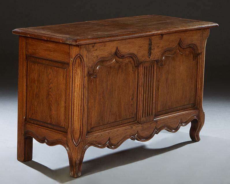 French Louis XV Style Carved Oak Coffer, 19th c., the stepped rounded edge top over a setback front (1 of 2)