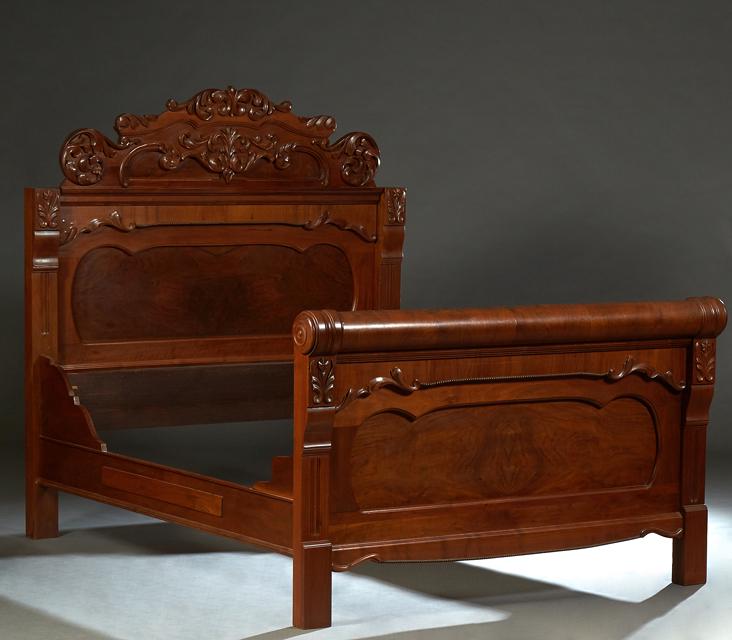 American Carved Walnut Highback Double Bed, late 19th c., the arched leaf and scroll crest above an (1 of 1)