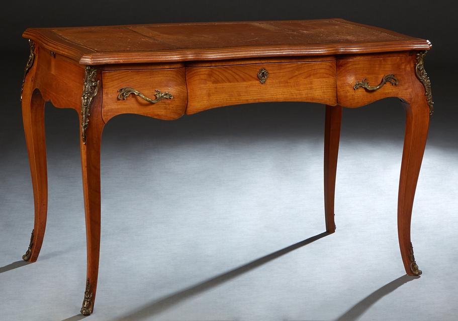 French Louis XV Style Ormolu Mounted Carved Cherry Writing Table, 20th c., the stepped serpentine (1 of 2)