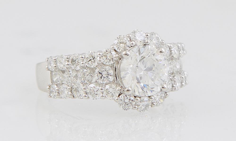 Lady's Platinum Dinner Ring, with a round 1.69 carat diamond, atop a diamond mounted border and (1 of 1)