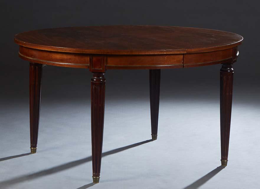 French Louis XVI Style Ormolu Mounted Carved Walnut Dining Table, 20th c., the oval top opening to (1 of 1)