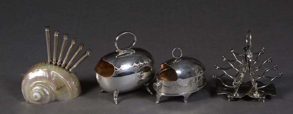 Four Pieces, consisting of a silverplated thistle form toast rack; two silverplate spoon warmers; (1 of 3)