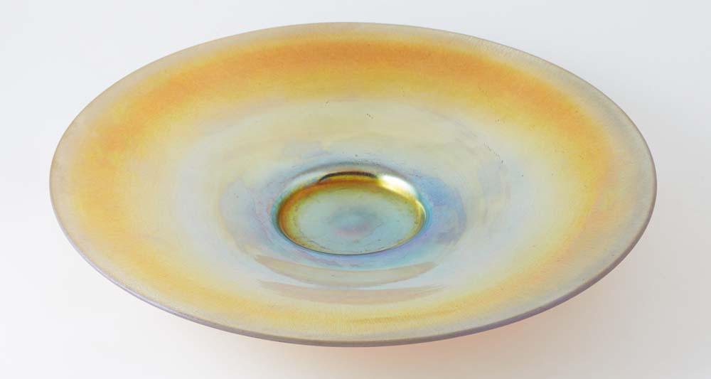 Steuben Gold Aurene Glass Center Bowl, early 20th c., the underside with a triangular "Steuben" foil: Steuben Gold Aurene Glass Center Bowl, early 20th c., the underside with a triangular "Steuben" foil label, and engraved "Aurene," and "2949," H.- 2 in., Dia.- 12 3/4 in.