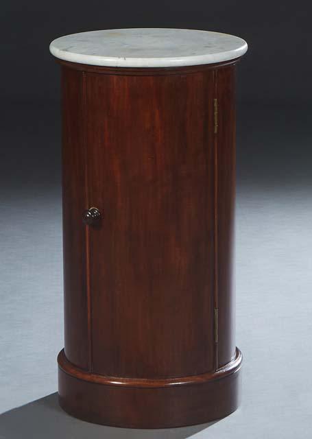 English Carved Mahogany Marble Top Columnar Nightstand, 19th c., the circular figured white marble: English Carved Mahogany Marble Top Columnar Nightstand, 19th c., the circular figured white marble over curved sides with one large cupboard door, on a plinth base, H.- 30 3/4 in., Dia.- 16 1/4 in.