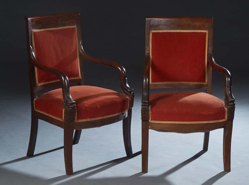 Pair of French Empire Style Carved Walnut Armchairs, 19th c., the wide crest rail over an (1 of 1)