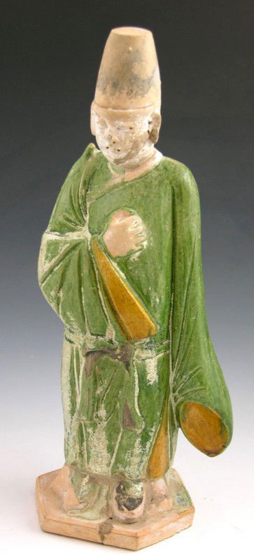 Chinese Glazed Pottery Earthenware Figure, pre 19th: Chinese Glazed Pottery Earthenware Figure, pre 19th c., of a man in a green and yellow robe, standing on a hexagonal base, H.- 12 1/2 in., Dia.- 4 1/4 in.