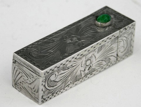 .800 Silver Lipstick Case, 20th c., with engraved : .800 Silver Lipstick Case, 20th c., with engraved decoration, with a turquoise mounted clasp, the side with a concealed mirror, H.- 2 1/4 in., W.- 3/4 in., D.- 3/4 in.