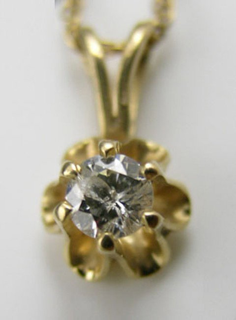 14K Yellow Gold Pendant, with a central 10 point