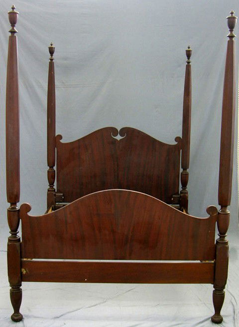 American Carved Mahogany Four Poster Bed, late 19: American Carved Mahogany Four Poster Bed, late 19th c., with an arched pierced headboard and an arched footboard, the tapered octagonal posts topped with urn finials, H.- 86 1/2 in., Int. W.- 56 in.,