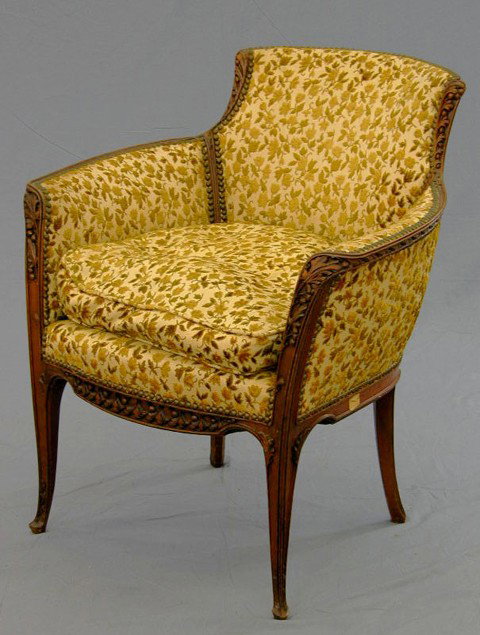 American Carved Mahogany Art Nouveau Upholstered : American Carved Mahogany Art Nouveau Upholstered Bergere, c. 1900, with leaf and berry carved back, arms and legs, now with floral upholstery with brass tack decoration, H.- 33 1/4 in.