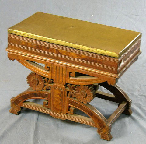 American Aesthetic Carved Walnut Music Bench, c. : American Aesthetic Carved Walnut Music Bench, c. 1880, with floral carved sides with trestle supports, with a sheet music storage area, the top replaced, H.- 16 in., W.- 20 1/4 in., D.- 11 in.