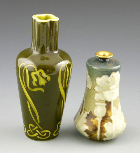 Two Art Nouveau Glazed Earthenware Vases, c. 1900,: Two Art Nouveau Glazed Earthenware Vases, c. 1900, one in olive glaze with yellow floral decoration, the other Bohemian, with a short neck and relief floral decoration.