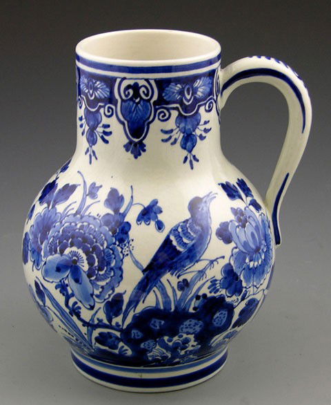 Delft Earthenware Pitcher, late 19th c., with blue: Delft Earthenware Pitcher, late 19th c., with blue floral decoration, H.- 8 1/4 in., W.- 7 in., D.- 6 in.