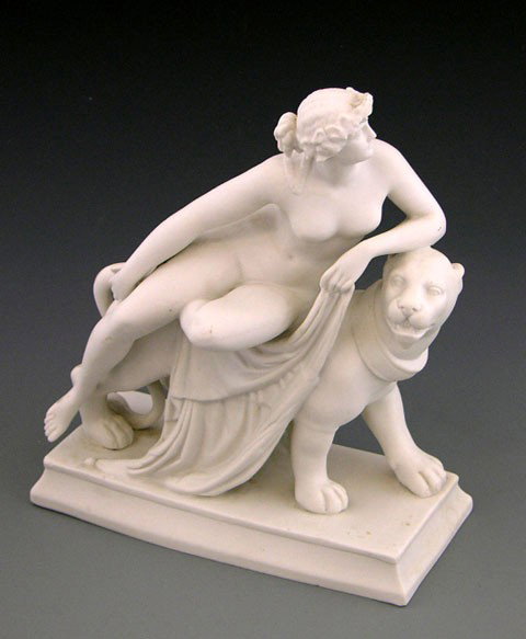 Parian Figure, 20th c., of a classical nude woman : Parian Figure, 20th c., of a classical nude woman reclining on a striding lion, H.- 9 1/8 in., W.- 7 3/4 in., D.- 3 1/4 in.