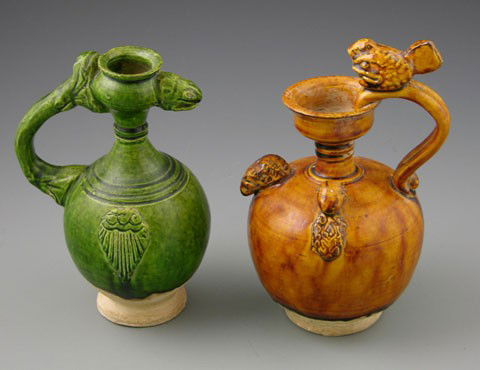 Two Chinese Glazed Earthenware Pitchers, 19th c.,: Two Chinese Glazed Earthenware Pitchers, 19th c., with applied figural decoration.