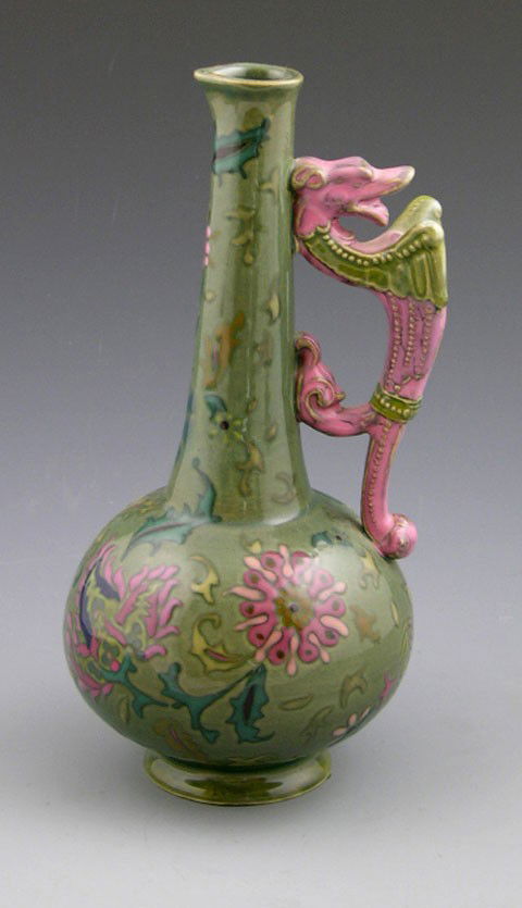 Zsolnay Glazed Earthenware Ewer, early 20th c., #4: Zsolnay Glazed Earthenware Ewer, early 20th c., #4751, with a winged dragon handle, and Art Nouveau floral decoration, on a green ground, H.- 9 1/2 in., Dia.- 4 3/4 in.