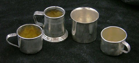 Four Pieces of Sterling- two baby cups, a miniatur: Four Pieces of Sterling- two baby cups, a miniature tankard by Cartier, engraved "JWK," and a beaker retailed by Black, Starr and Frost, Wt.- 5.98 troy oz.