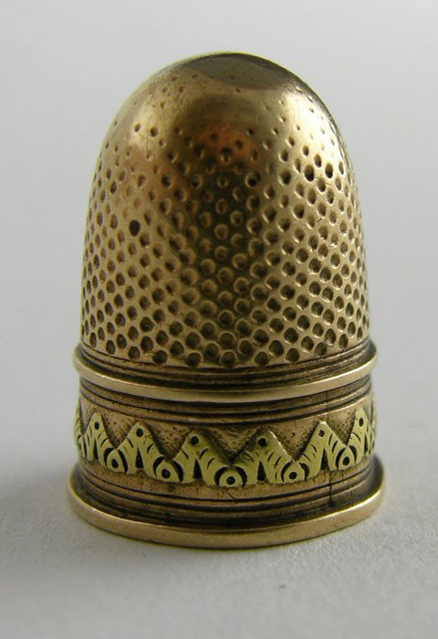 Yellow Gold Thimble, 19th c., with relief decorati: Yellow Gold Thimble, 19th c., with relief decoration, H.- 1 in., Dia.- 11/16 in., wt.- .16 troy oz.