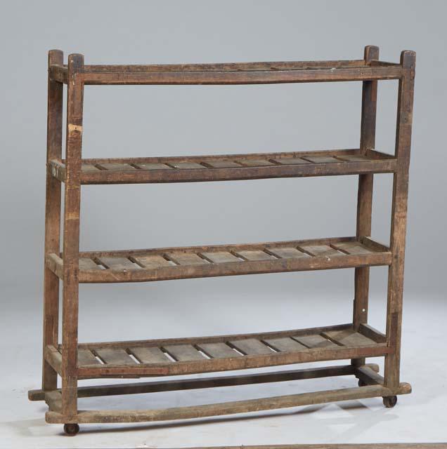French Provincial Carved Pine Drying Rack, 19th c., with four galleried plank shelves on block feet, (1 of 1)