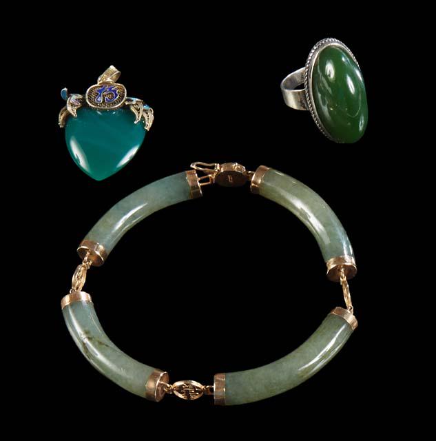 Three Pieces of Jade Jewelry, consisting of a Mexican sterling cabochon oval jade ring, size 7; a (1 of 1)