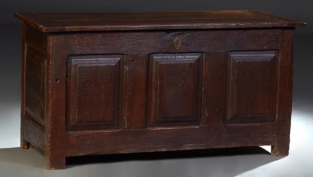 Large French Provincial Carved Oak Coffer, early 19th c., stepped rectangular top over a front with (1 of 2)