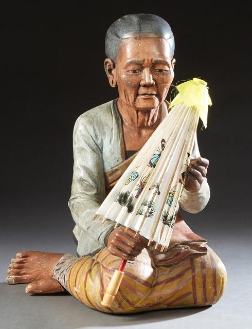 Burmese Carved Polychromed Figure of a Seated Older Woman, 20th/21st c., holding an umbrella, H.- 23: Burmese Carved Polychromed Figure of a Seated Older Woman, 20th/21st c., holding an umbrella, H.- 23 1/2 in., W.- 15 in., D.- 16 in.