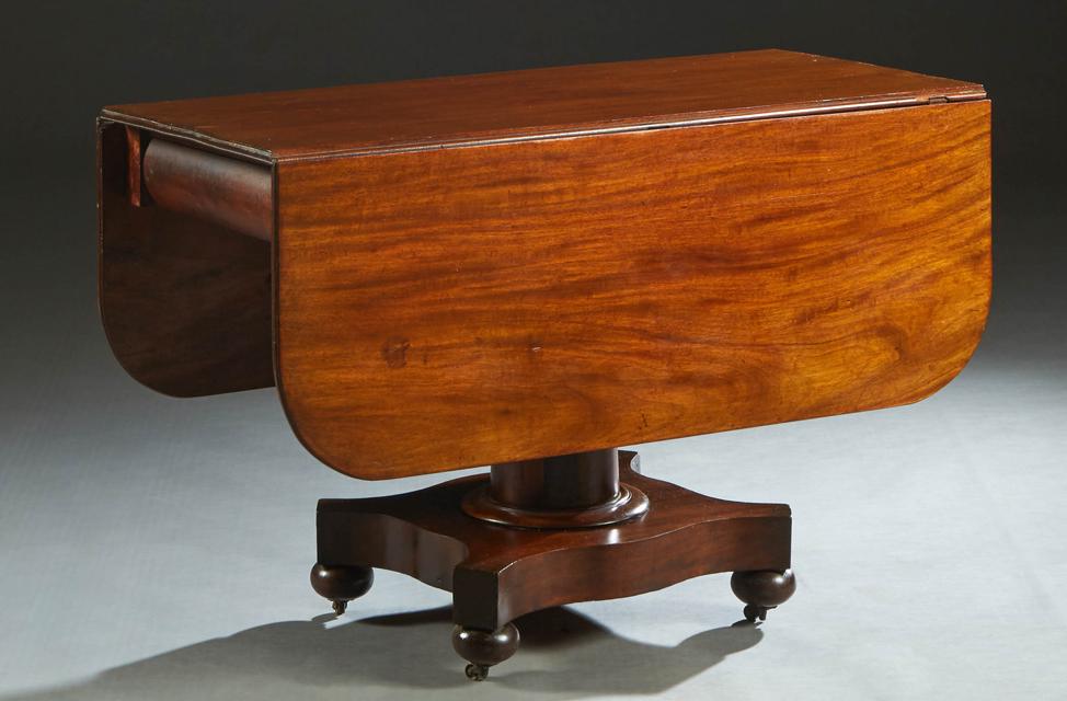 American Empire Carved Mahogany Dropleaf Table, late 19th c., with two rounded corner leaves (1 of 3)