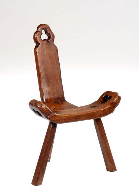 Spanish Provincial Carved Oak Hall Chair, 20th c., the canted single plank back over a curved seat, (1 of 1)