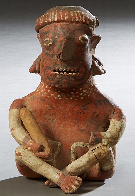 Pre-Columbian Pottery Figure, of a cross legged seated man with a stick in his right hand , with (1 of 1)
