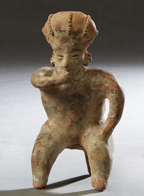 Pre-Columbian Pottery Figure, of a seated man with his hand in his mouth, H.- 10 1/2 in., W.- 5 1/2 (1 of 1)