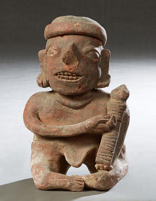 Pre-Columbian Pottery Figure, of a seated man using a grater, H.- 10 in., W.- 6 in., D.- 4 1/2 in. (1 of 1)