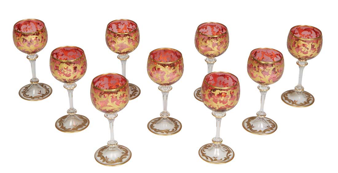 Set of Nine Style Moser Cranberry Gilt Decorated Dessert Wine Glasses, early 20th c., unsigned, H.-: Set of Nine Style Moser Cranberry Gilt Decorated Dessert Wine Glasses, early 20th c., unsigned, H.- 5 3/4 in., Dia.- 2 3/8 in.