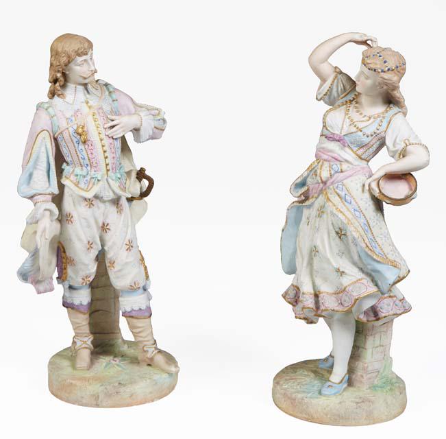 Pair of Continental Polychromed Porcelain Figures, late 19th c., of a man and woman in 19th c., (1 of 4)