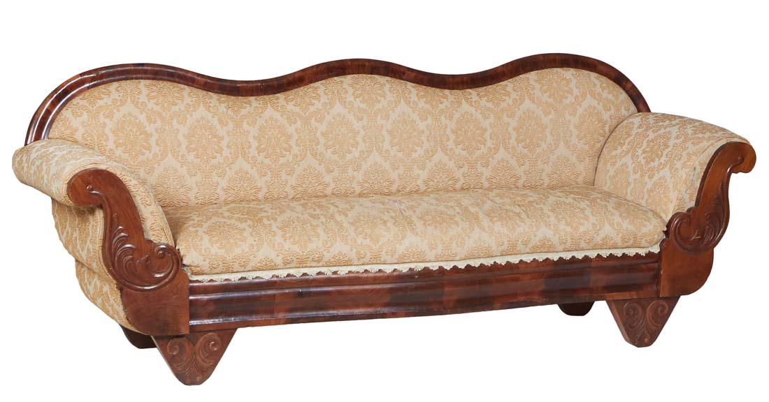 American Classical Carved Mahogany Settee, 19th c., the serpentine back to upholstered rolled arms, (1 of 1)