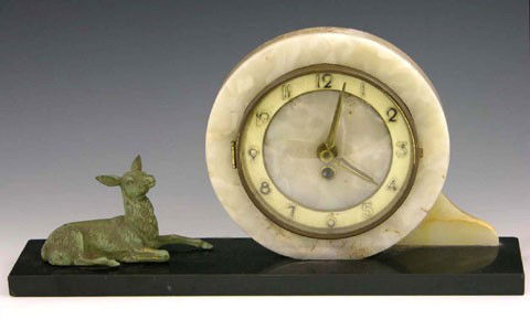 French Art Deco Marble and Onyx Mantel Clock, c. 1: French Art Deco Marble and Onyx Mantel Clock, c. 1940, the circular tan marble and onyx clock next to a recumbent patinated brass lamb, the whole on a black marble base, H.- 9 in., W.- 17 7/8 in., D.-