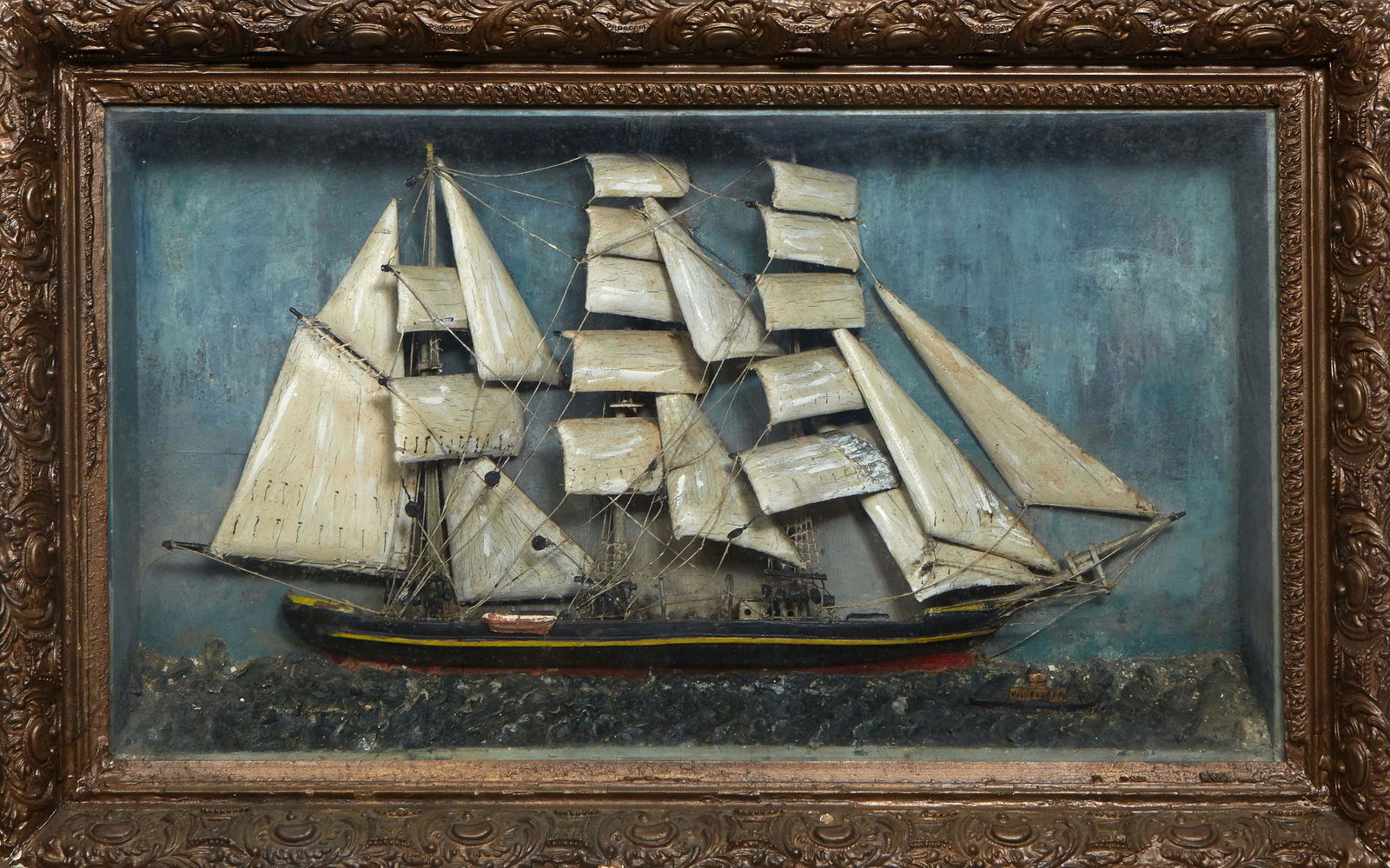 Carved Wood Diorama, 19th c., of a clipper ship in full sail, presented in a gilt and gesso (1 of 1)